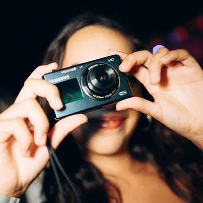 Girl holding camera Lust in Rio